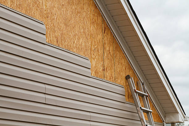 Professional Storm Damage Siding Repair technician working in Haw River, NC